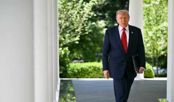 President Donald Trump exits the Oval Office and arrives to speak during a Mother's Day luncheon in the Rose Garden of the White House in Washington, D.C., on May 8, 2026.