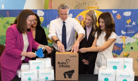 Elizabeth Landsberg, Kim Johnson, Gavin Newsom, Kelly Sawyer Patricof, and Norah Weinstein fill diaper boxes at the Baby2Baby x Golden State Start event at Children’s Creativity Museum on May 8, 2026, in San Francisco, California.