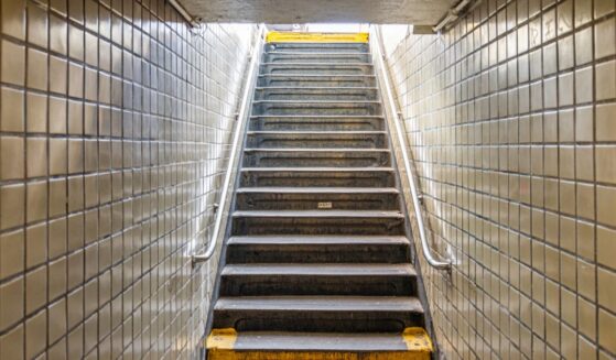 Stairs leading up to the street from an underground subway station in New York City.