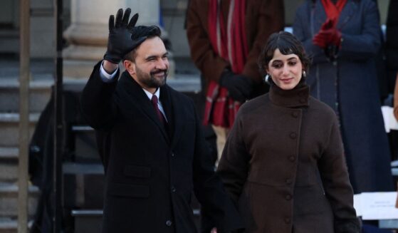 New York City Mayor Zohran Mamdani waves next to his wife Rama Duwaji during his public inauguration ceremony followed by a block party at City Hall in New York on Jan. 1, 2026.