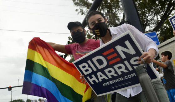 Supporters of now-former President Joe Biden and Vice President Kamala Harris gather in the street as they celebrate on Nov. 7, 2020, in Wilton Manors, Florida.