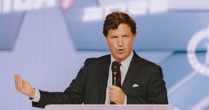 Conservative political commentator and podcast host Tucker Carlson speaks at Turning Point USA's annual AmericaFest conference, in remembrance of late political activist Charlie Kirk, in Phoenix, Arizona, on Dec. 18, 2025.