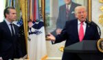 President Donald Trump takes questions as Secretary of War Pete Hegseth looks on during a ceremony for newly sworn in Secretary of the Department of Homeland Security Markwayne Mullin in the Oval Office at the White House on March 24, 2026, in Washington, D.C.