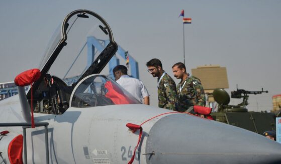 Military officials look at an Pakistan's JF-17 Thunder aircraft during International Defence Exhibition and Seminar 2022 at the Expo Centre in Karachi on Nov. 16, 2022.
