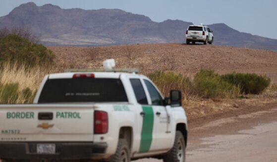 Border Patrol vehicles are pictured along the fence at the U.S. border with Mexico, in Douglas, Arizona, in an April 2025 file photo.