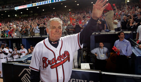 Atlanta Braves manager Bobby Cox waves to the crowd after a loss tot he San Francisco Giants in Game 4 of the National League Division Series in Atlanta on Oct. 11, 2010.