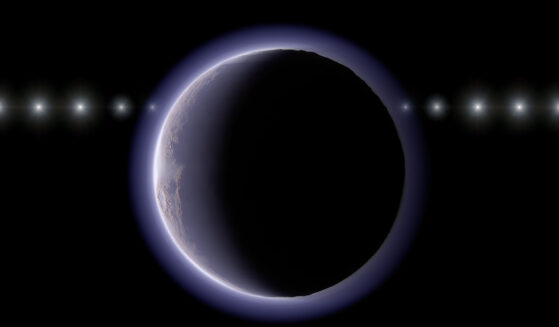 This image provided by NAOJ shows artist’s impression of the trans-Neptunian object 2002 XV93 occulting a background star. Observations of a stellar occultation in January 2024 revealed gradual fading and recovery of the starlight, providing evidence for a very thin atmosphere around the object.
