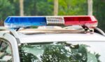 A law enforcement vehicle with lights flashing.