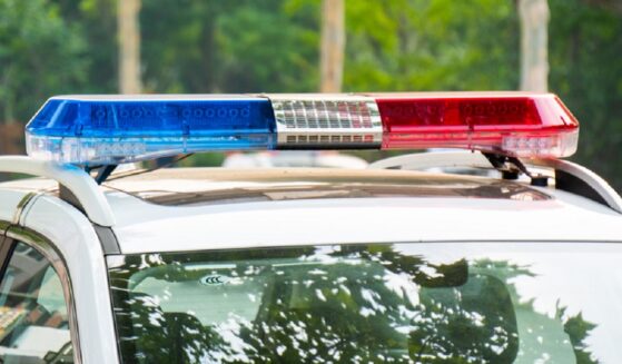 A law enforcement vehicle with lights flashing.