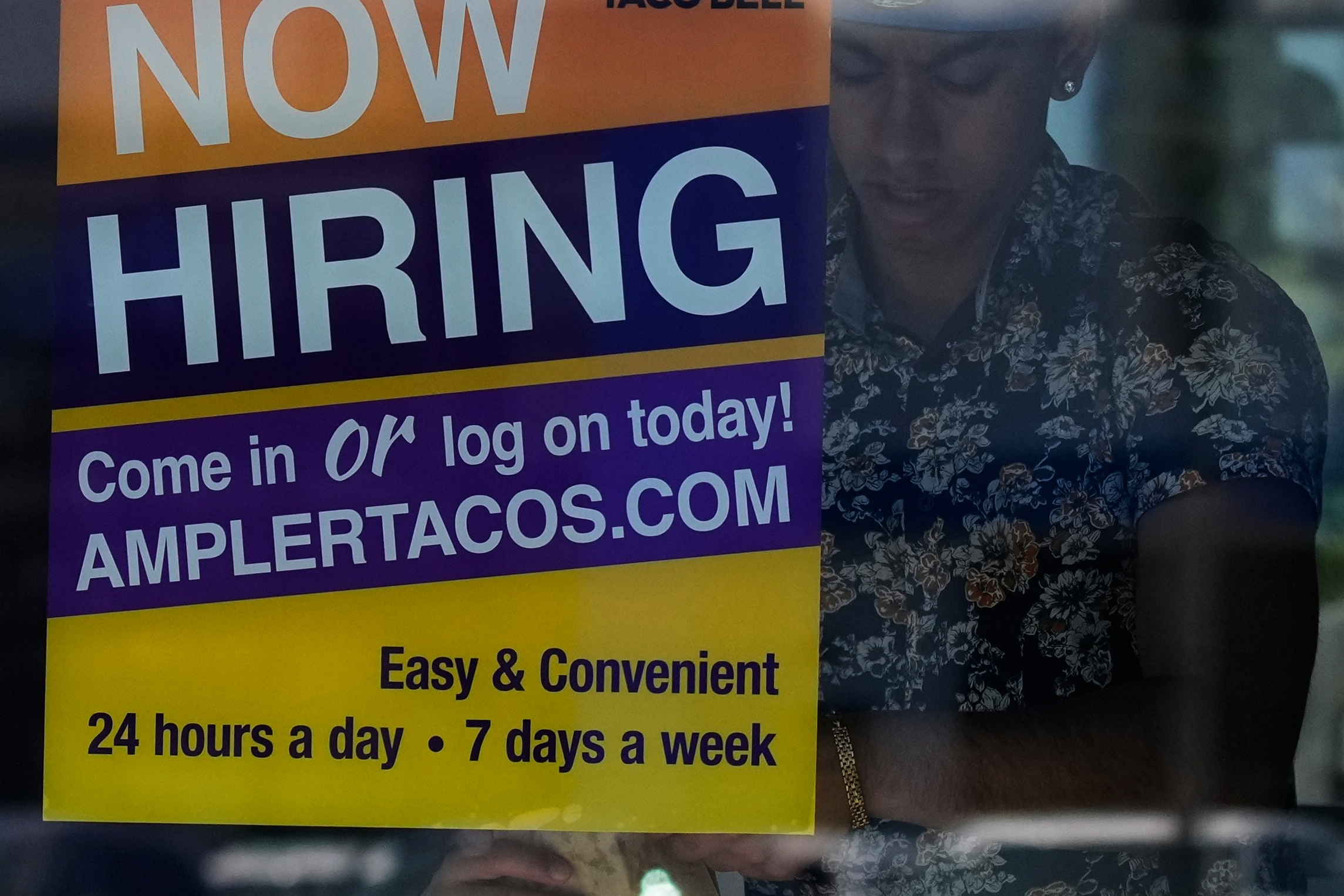 A hiring sign is displayed at a restaurant in Niles, Illinois, on May 14, 2026.