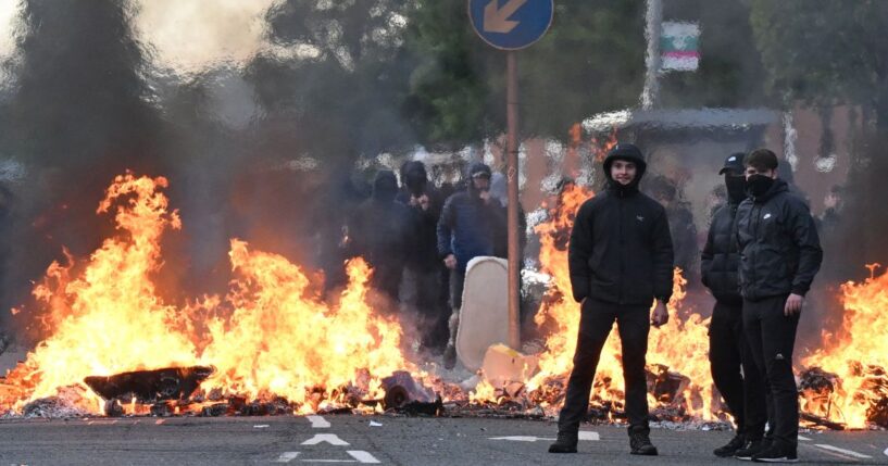 Youths gather in front of a burning barricade Wednesday in Belfast, Northern Ireland.