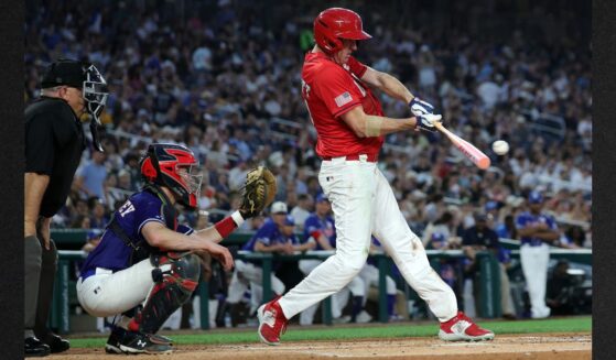 GOP Sen. Eric Schmitt of Missouri connects for a single in the fifth inning during Wednesday's congressional baseball game at Nationals Park in Washington, D.C. The annual game that began in 1901 pits Republican and Democratic congressional members and raises money for charity.