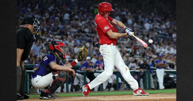 GOP Sen. Eric Schmitt of Missouri connects for a single in the fifth inning during Wednesday's congressional baseball game at Nationals Park in Washington, D.C. The annual game that began in 1901 pits Republican and Democratic congressional members and raises money for charity.