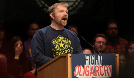 Democratic U.S. Senate candidate Graham Platner of Maine speaks at a “Fighting Oligarchy” tour stop held by Vermont Sen. Bernie Sanders May 24 in Orono, Maine.