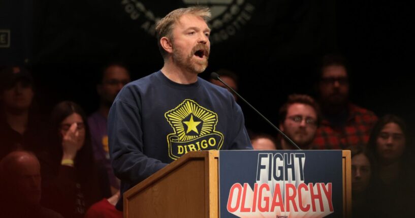 Democratic U.S. Senate candidate Graham Platner of Maine speaks at a “Fighting Oligarchy” tour stop held by Vermont Sen. Bernie Sanders May 24 in Orono, Maine.