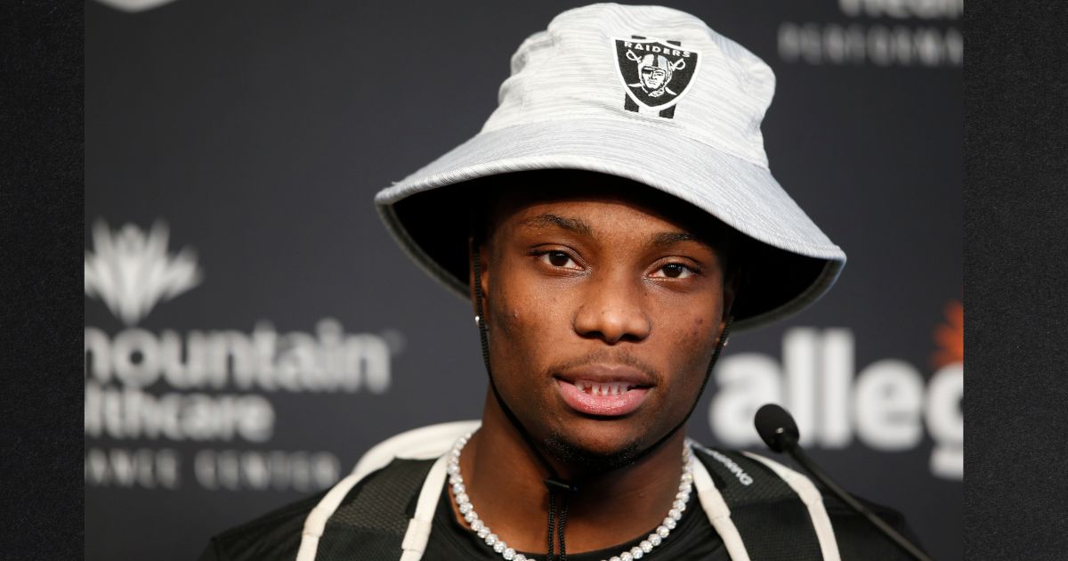Henry Ruggs III speaks with reporters at the Las Vegas Raiders Headquarters in Henderson, Nevada, in a file photo dated July 28, 2021, a few months before the deadly DUI crash that killed a woman and sidelined his career.