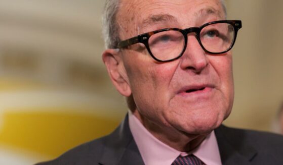 Senate Minority Leader Chuck Schumer stands in a hallway as he takes questions from the press on June 2, 2026.