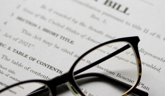 Glasses sit on a piece of legislation.