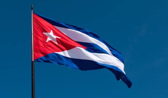 The Cuban flag flies in the wind.