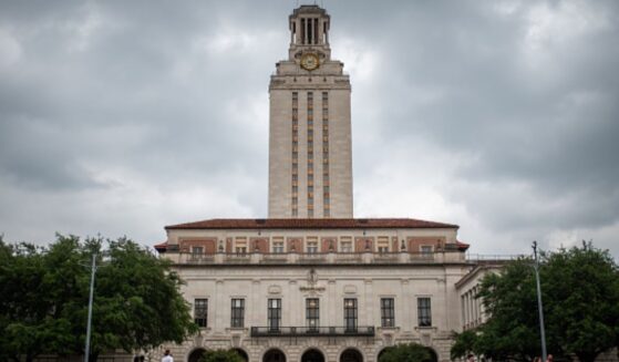 The University of Texas stands behind stormy skies in Austin, Texas on April 26, 2024.
