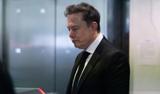 Elon Musk walks into an elevator at the Ronald V. Dellums Federal Court Building on April 28, 2026.