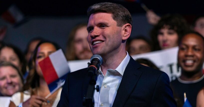 James Talarico stands among a cheering crowd on a campaign stop to Austin, Texas on March 3, 2026.