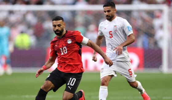 Mohamed Salah, playing for Egypt, and Milad Mohammadi, playing for Iran, play on a soccer field in Seattle, Washington on June 26, 2026.