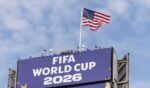 The American flag flies above FIFA World Cup signage in Seattle, Washington on June 19, 2026.