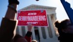 Gerrymandering protesters demonstrate outside the Supreme Court building on March 19, 2019.