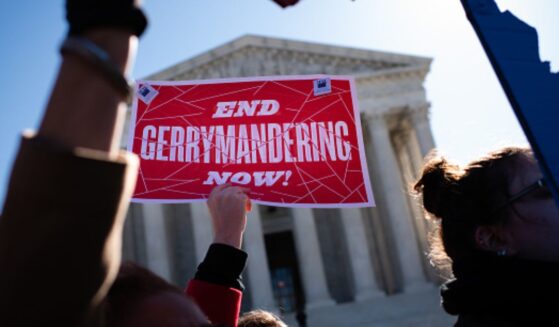 Gerrymandering protesters demonstrate outside the Supreme Court building on March 19, 2019.
