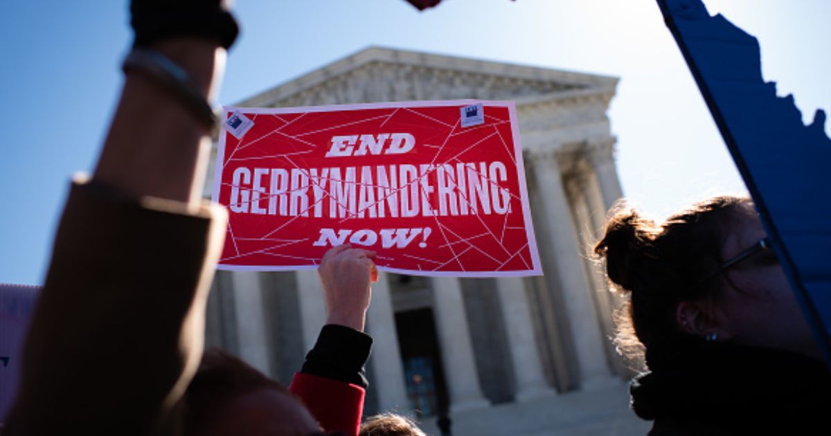Gerrymandering protesters demonstrate outside the Supreme Court building on March 19, 2019.