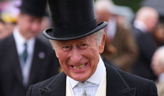 King Charles III is pictured smiling during a garden party at the Palace of Holyroodhouse on June 30, 2026.