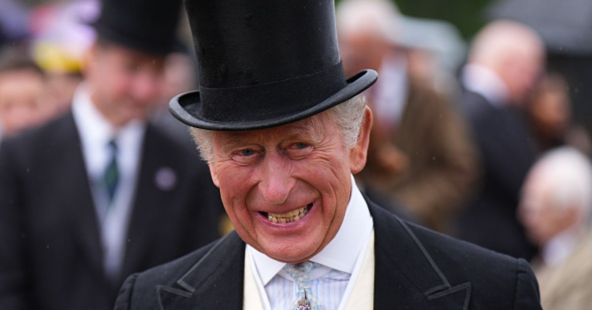 King Charles III is pictured smiling during a garden party at the Palace of Holyroodhouse on June 30, 2026.