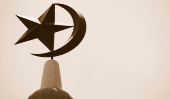 The Crescent Moon and Star stand atop a mosque in Singapore.