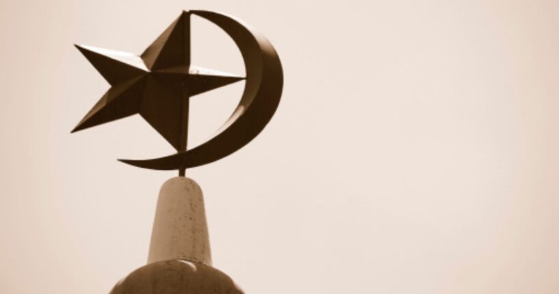 The Crescent Moon and Star stand atop a mosque in Singapore.