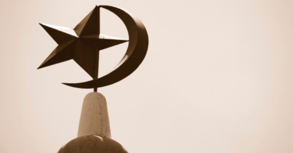 The Crescent Moon and Star stand atop a mosque in Singapore.