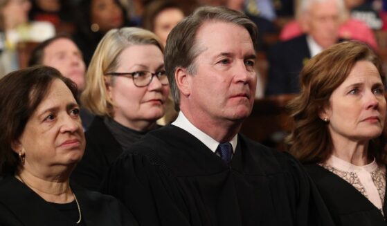 Supreme Court Chief Justice John Roberts, center, was joined by Supreme Court Justices Elena Kagan, left, and Amy Coney Barrett, right, along with Kagan's fellow liberals, Sonia Sotomayor and Ketanji Brown-Jackson, on the ruling.