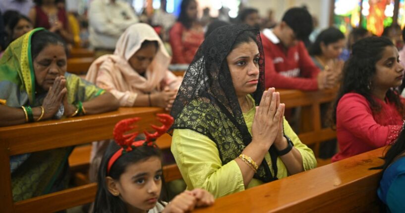 Christians pray at a church in Bengaluru, India on Dec. 25, 2025.