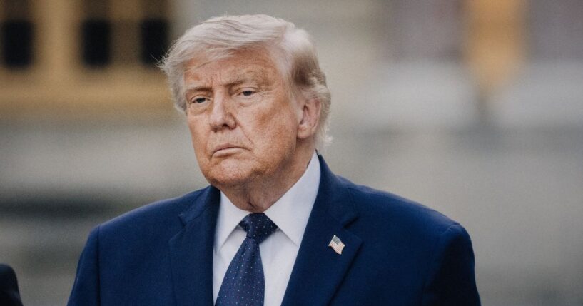 President Donald Trump poses and raises a fist after arriving to a dinner with the President of the French Republic at the Chateau de Versailles in Versailles France on June 17, 2026.