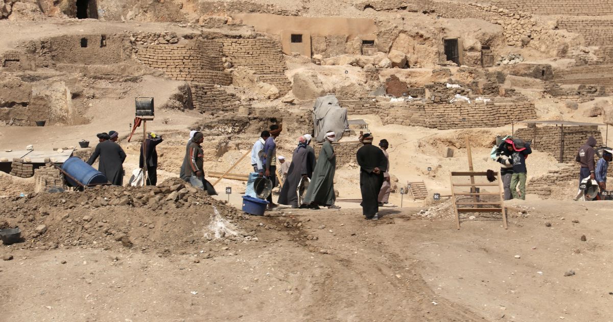 Workers walk through an archeological site in Egypt in February of 2018.