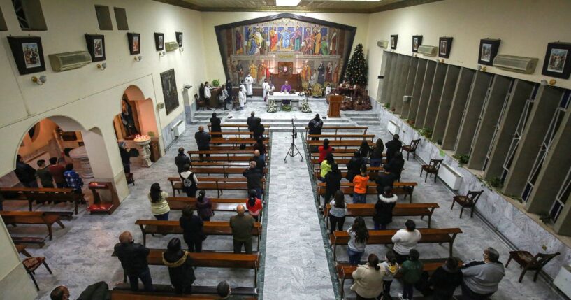 Worshippers pray in a Roman Catholic Church in Marka, east of Jordan's capital, on Dec. 13, 2020.