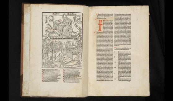 Illuminated pages of a book written in Latin by Augustine of Hippo.