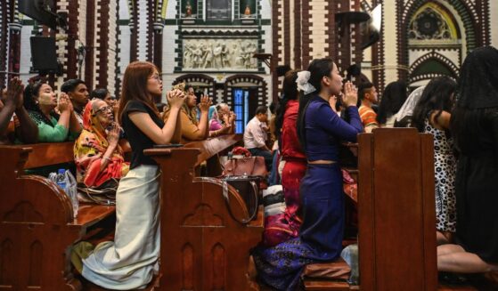 Christians pray at a church on Christmas Eve in Yangon on Dec. 24, 2025.