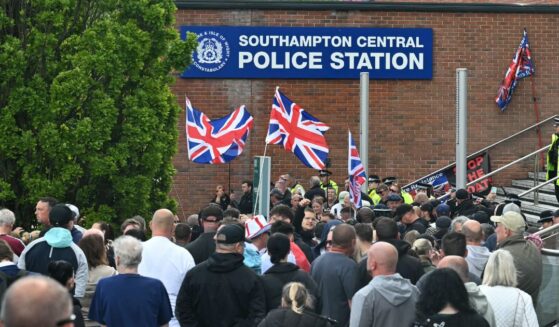 Demonstrators protest Tuesday outside of Southampton Central Police Station in Southampton, southern England, following the conviction of Vickrum Digwa for the murder of Henry Nowak.