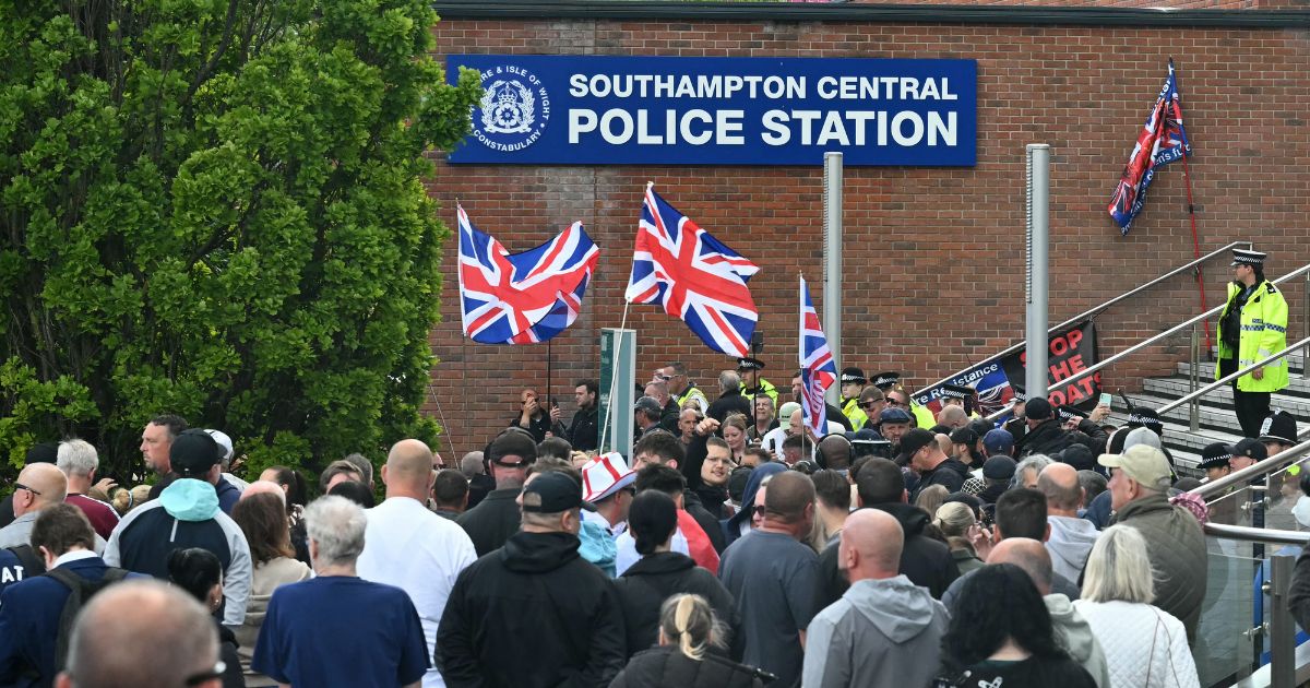 Demonstrators protest Tuesday outside of Southampton Central Police Station in Southampton, southern England, following the conviction of Vickrum Digwa for the murder of Henry Nowak.