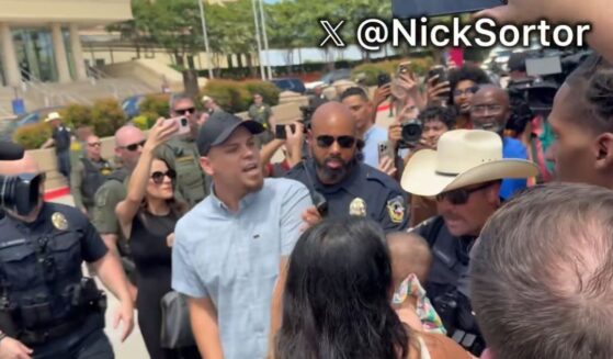 Police had to intervene as the crowd grew more hostile.