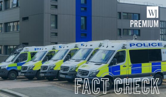 Police vans parked in a row outside Brighton police station in East Sussex in southeast England on May 12, 2026.