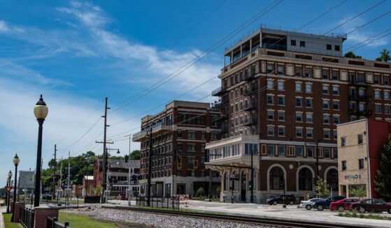 A view of the former Hotel Muscatine and the newly built Merrill Hotel and Conference Center as viewed from Harbor Drive in Riverside Park in Muscatine, Iowa, on July 17, 2018.