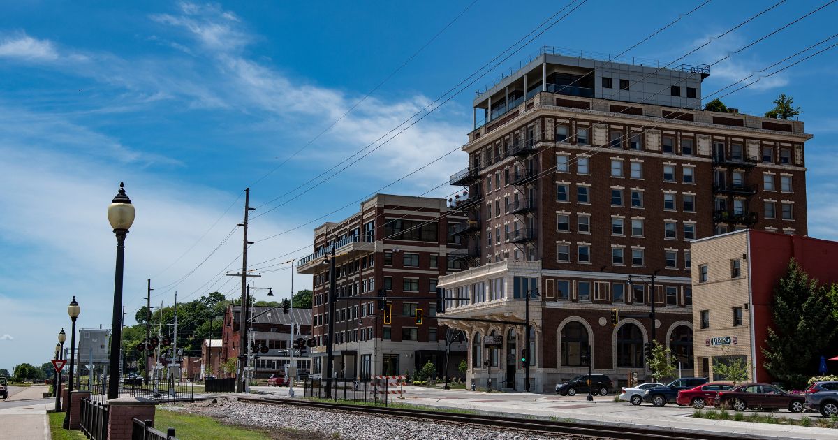 A view of the former Hotel Muscatine and the newly built Merrill Hotel and Conference Center as viewed from Harbor Drive in Riverside Park in Muscatine, Iowa, on July 17, 2018.