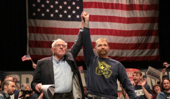 Sen. Bernie Sanders and Democratic U.S. Senate candidate Graham Platner stand together during a “Fighting Oligarchy” tour stop at the Collins Center for the Arts on the University of Maine campus on May 24, 2026, in Orono, Maine.